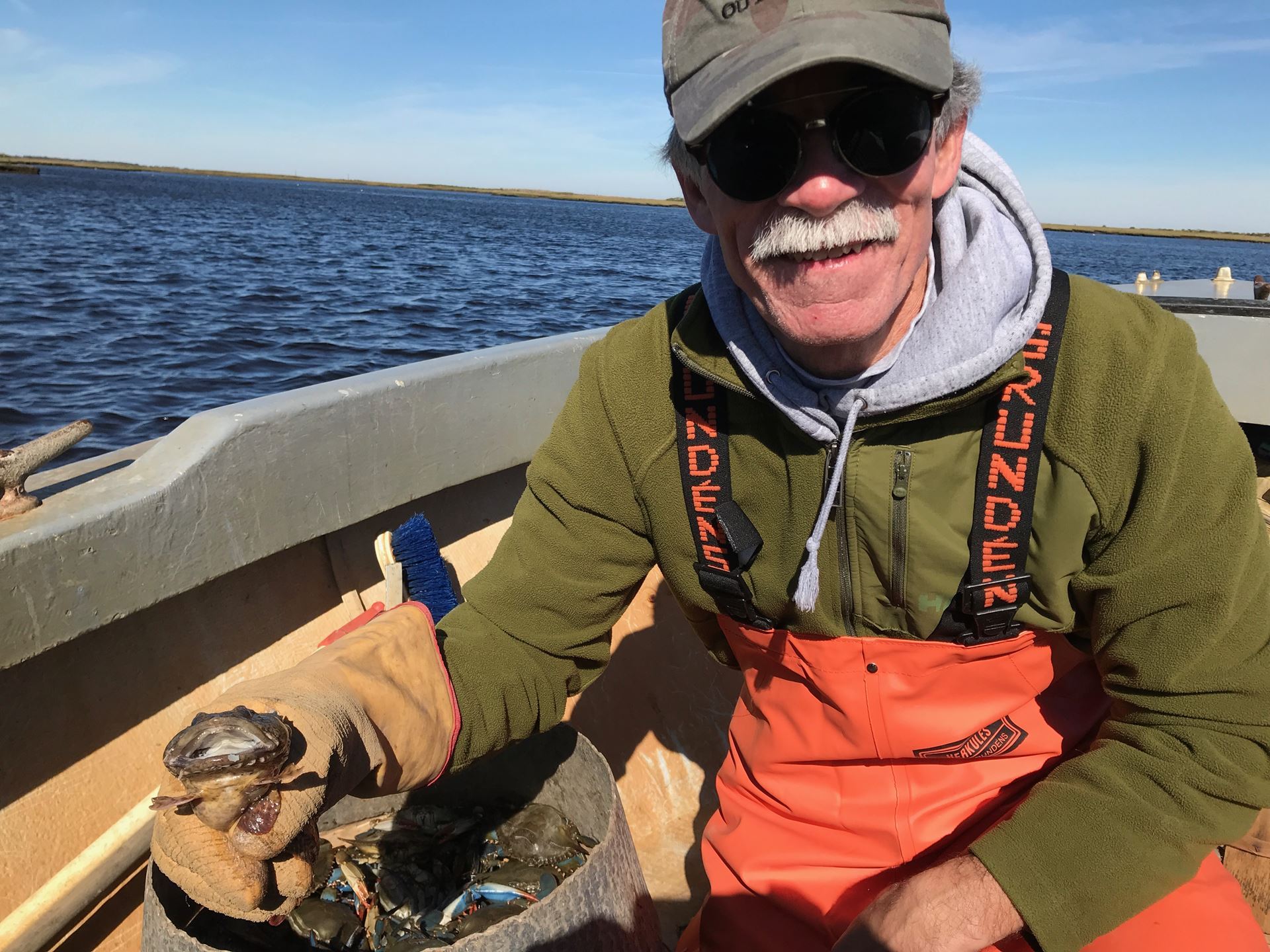Michael Chiarappa-holding an oyster cracker fish while doing field work documenting the maritime cultural landscape. Photo courtesy of Michael Chiarappa.